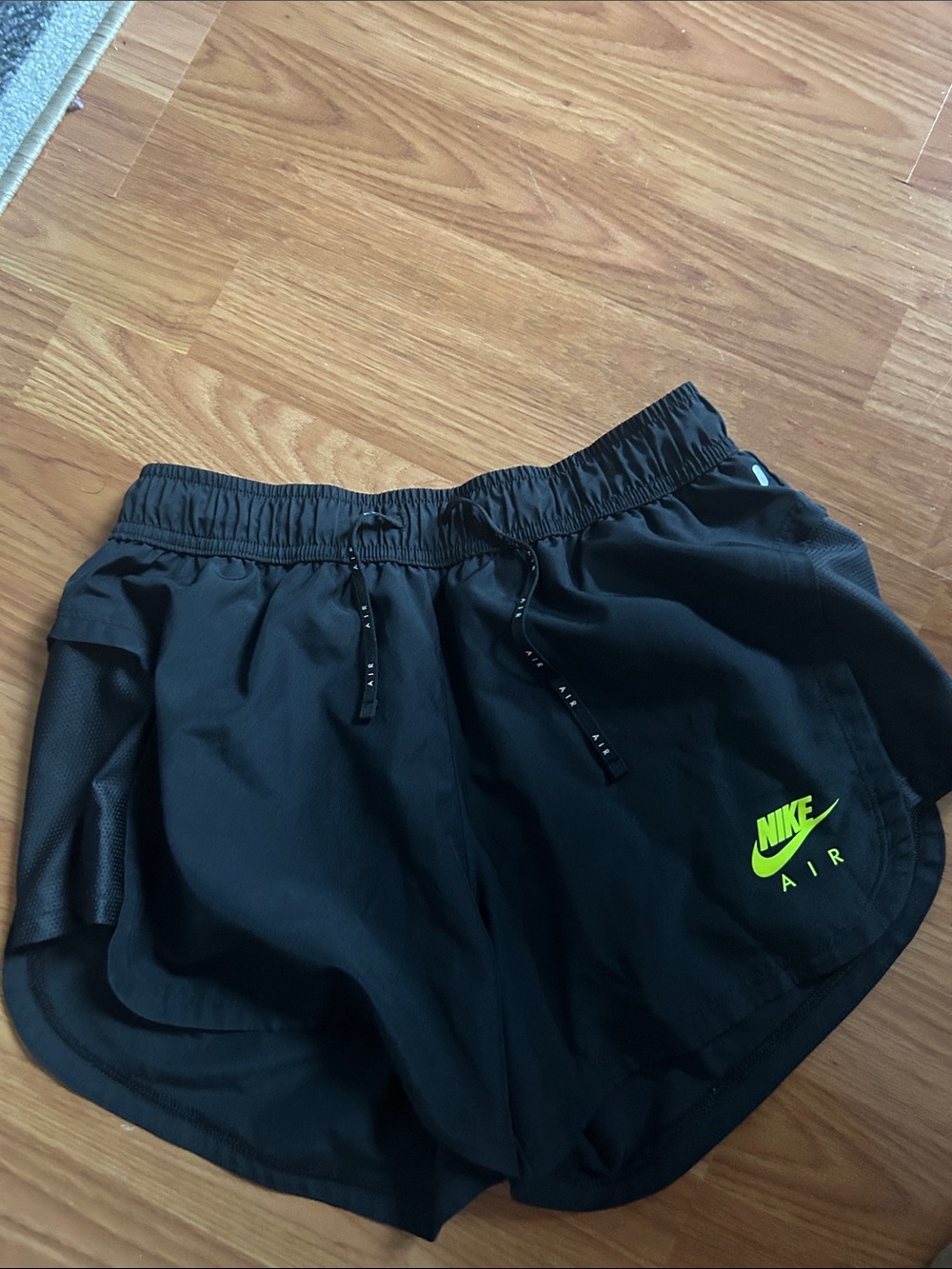 Nike Women's Black Athletic Shorts with Neon Yellow-Green Logo